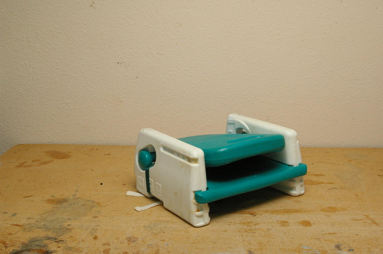 Travel booster in folded position