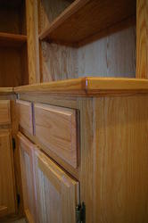 Close up of outer corner of side bookshelf